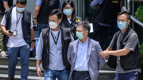 Hong Kong police charge 2 people with ‘collusion with a foreign country’ after arrests at Apple Daily newspaper