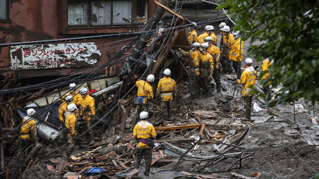 1,500 rescuers wade through mud to find survivors in wake of catastrophic landslide in Japan