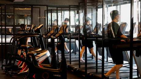 Turn down the music & slow your treadmill! Seoul introduces bizarre Covid-19 measures to combat virus surge